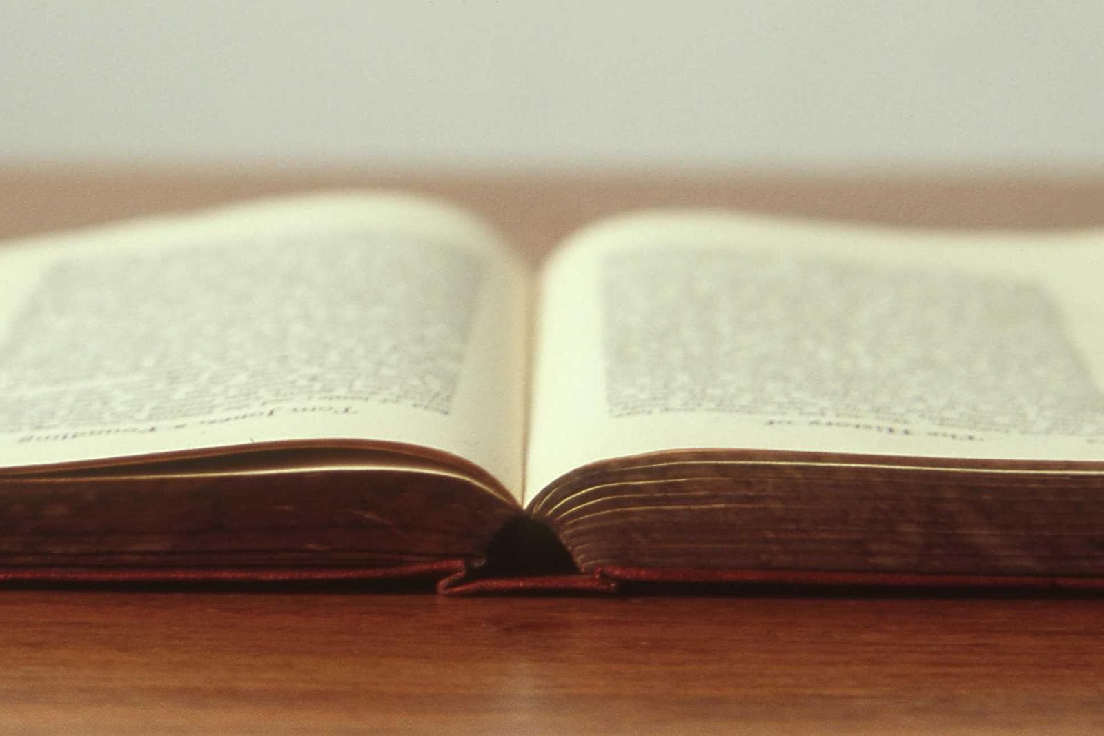 Placeholder image: A printed monthly report on a wooden desk